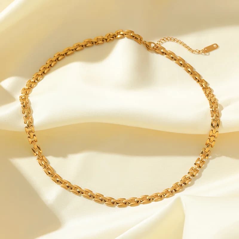 Guld geometrisk kedjehalsband och armbandset