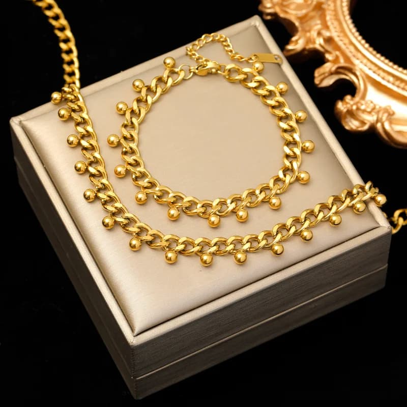Halsband och armband i grov kedja, guld