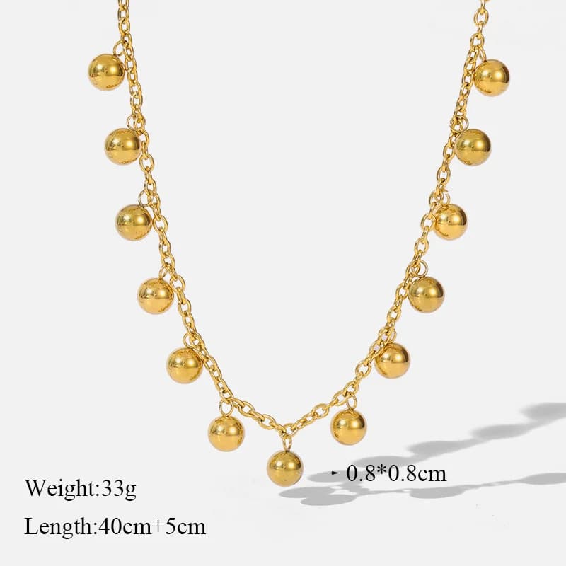 Guld choker med kula som berlock